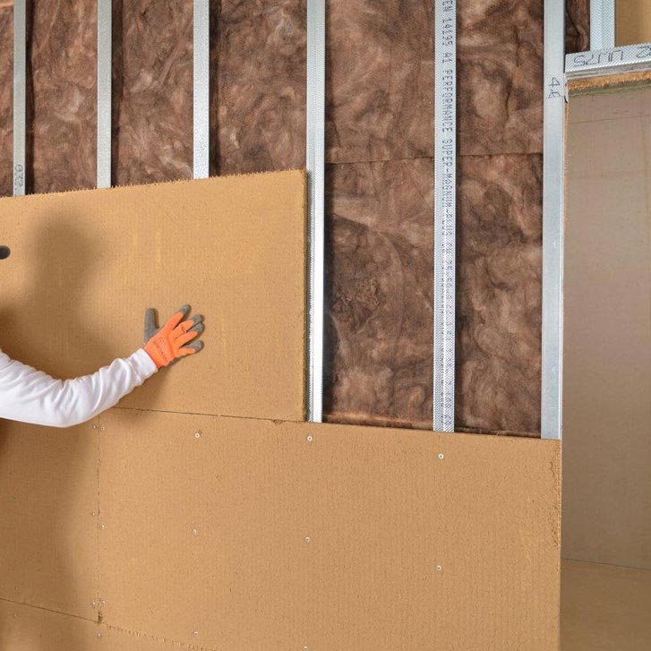 Pannelli isolanti in fibra di legno FiberTherm Isorel posa su parete